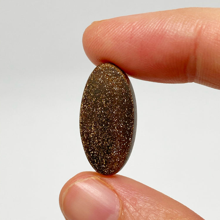 9.54 Ct purple oval boulder opal