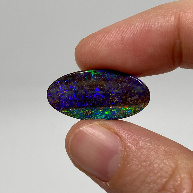 9.54 Ct purple oval boulder opal